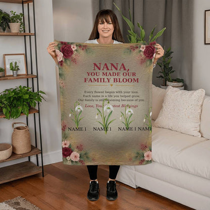 Nana You Made Our Family Bloom blanket held in a living room