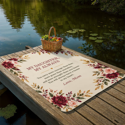 My Daughter My Always blanket displayed beside a peaceful lake